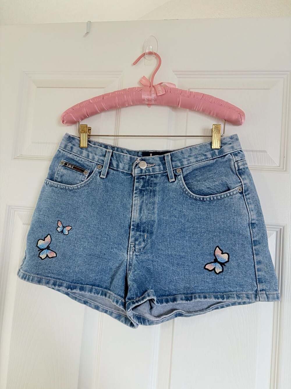 Y2k jean shorts w a hand painted butterflies on...